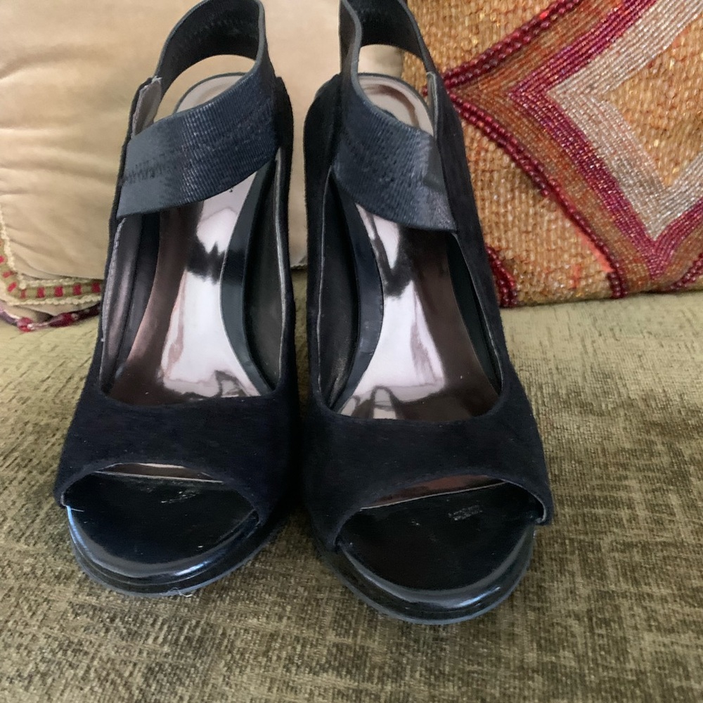 Black high heels. Unique style very flattering.